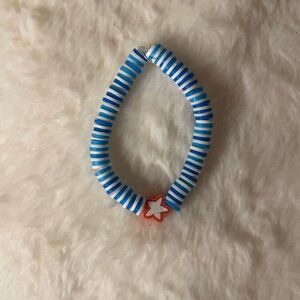 Blue clay bead bracelet with red star